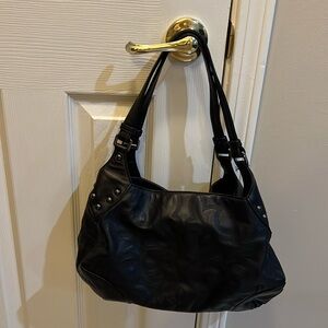 Donald Pliner handbag in Black with pattern in leather.